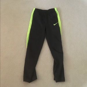 Safety green and grey nike pants
